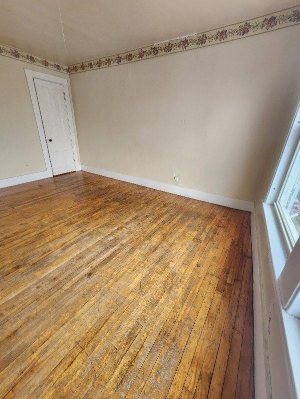 52 Hampshire St, Auburn, ME 04210 - empty room with wood-type flooring
