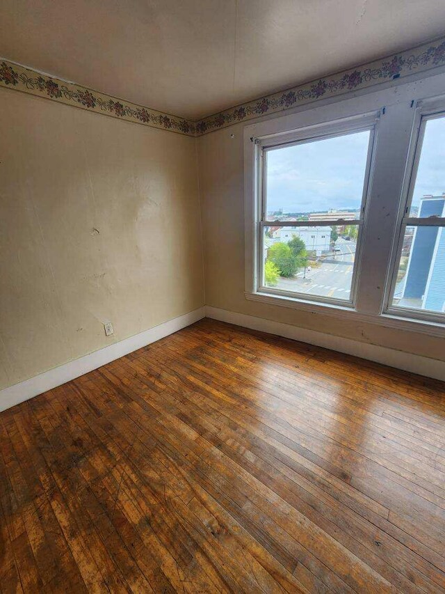52 Hampshire St, Auburn, ME 04210 - spare room featuring hardwood / wood-style flooring