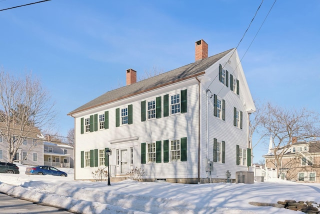 colonial house featuring central AC