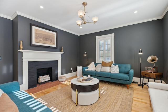 living room featuring hardwood / wood-style floors, a notable chandelier, and ornamental molding