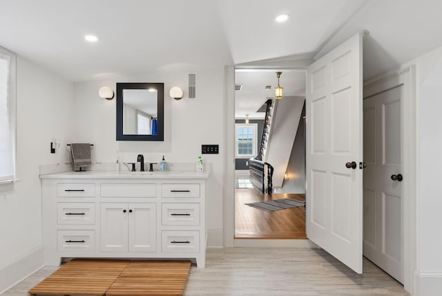 bathroom with wood-type flooring and vanity