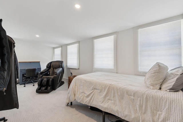 bedroom featuring light carpet