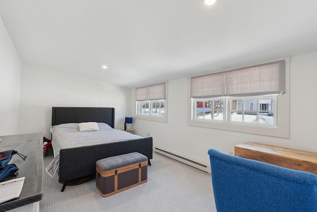 carpeted bedroom with a baseboard radiator