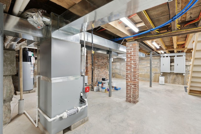 basement featuring electric water heater and electric panel