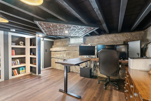 office space with wood-type flooring and built in features