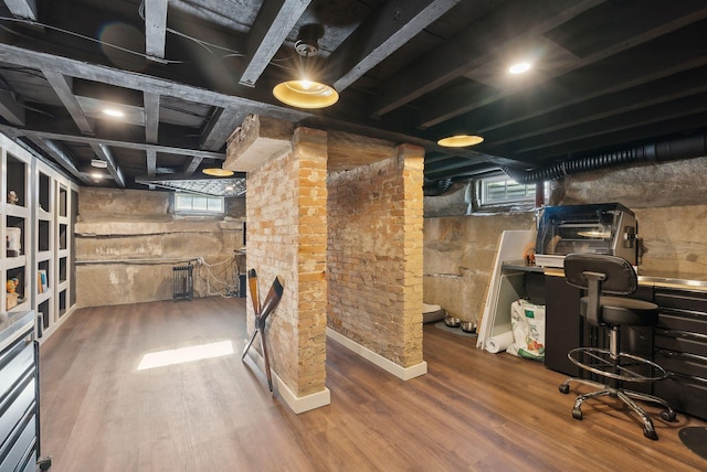 basement with wood-type flooring