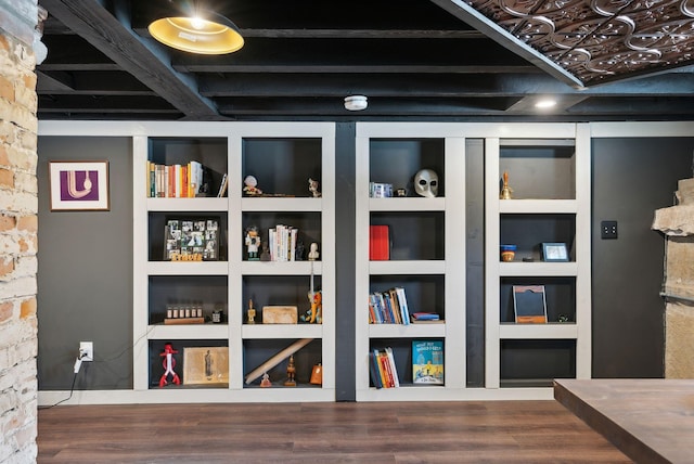 room details featuring hardwood / wood-style floors and built in features