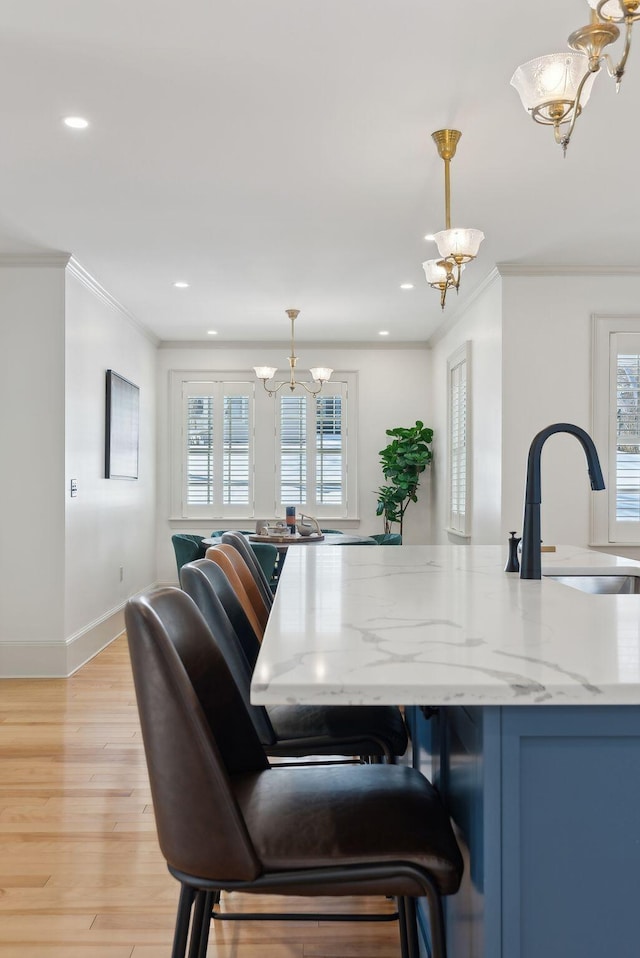 kitchen with hanging light fixtures, sink, and an inviting chandelier