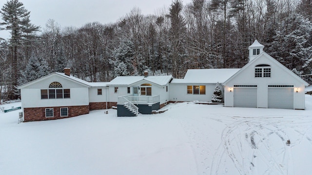 view of front facade featuring a garage and a deck