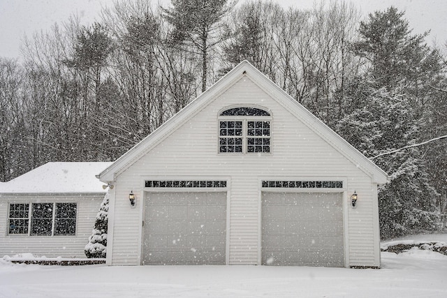 view of snow covered garage