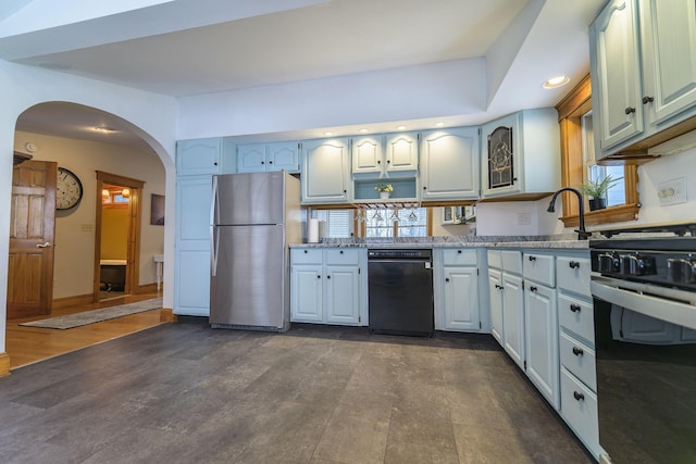 kitchen featuring stainless steel refrigerator, dishwasher, and gas stove