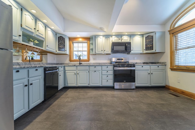 kitchen with lofted ceiling, sink, gray cabinets, and black appliances