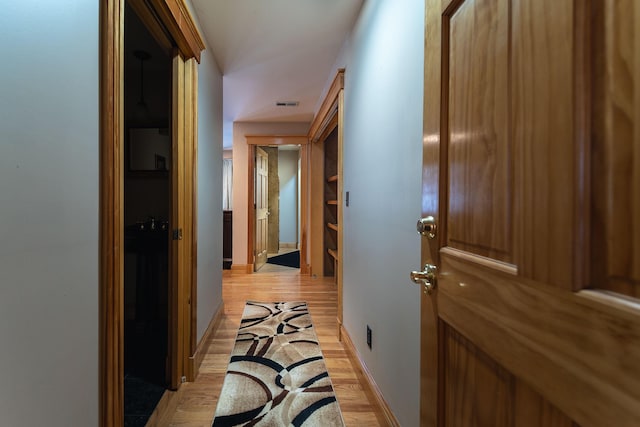 corridor featuring light hardwood / wood-style flooring