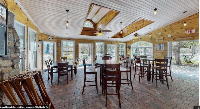 557 Coles Hill Rd, Wells, ME 04090 - dining space featuring high vaulted ceiling and wood walls