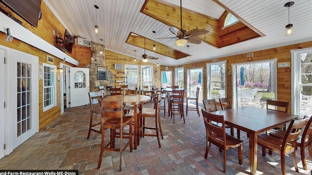 557 Coles Hill Rd, Wells, ME 04090 - dining room with wood walls, wood ceiling, a skylight, high vaulted ceiling, and ceiling fan