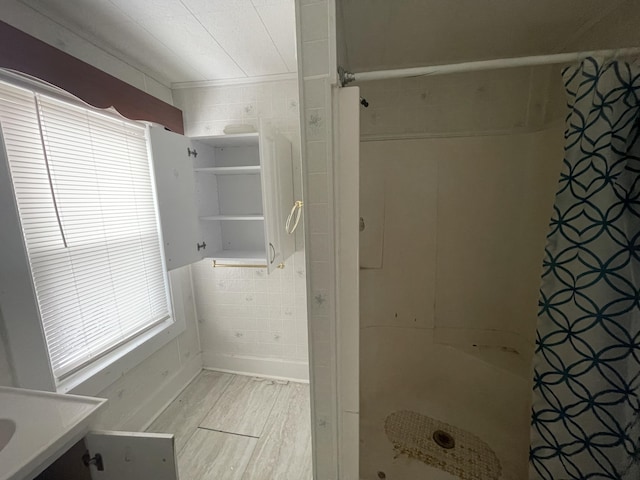 bathroom with hardwood / wood-style floors