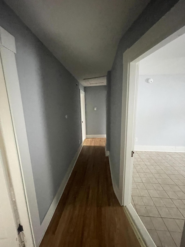 corridor with wood-type flooring