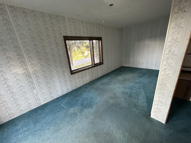 empty room with dark carpet