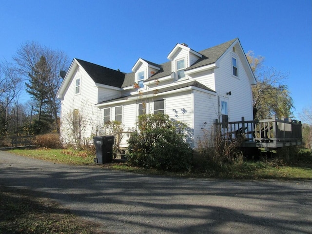 view of home's exterior with a deck