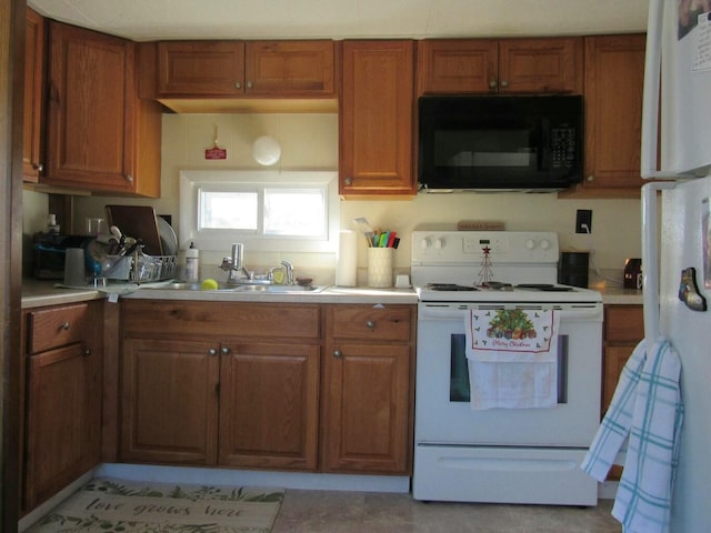 kitchen with white appliances and sink