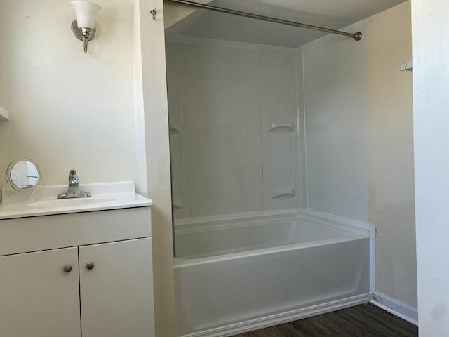 bathroom with shower / bath combination, vanity, and hardwood / wood-style floors