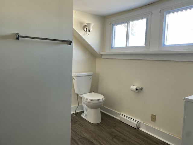 bathroom featuring a baseboard radiator, vanity, toilet, and hardwood / wood-style floors