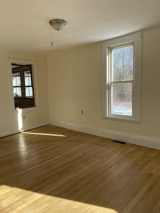 unfurnished room featuring hardwood / wood-style floors