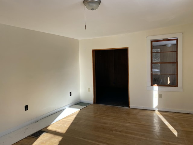 spare room featuring dark hardwood / wood-style floors