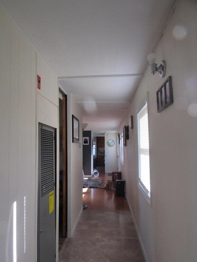 corridor featuring dark hardwood / wood-style floors