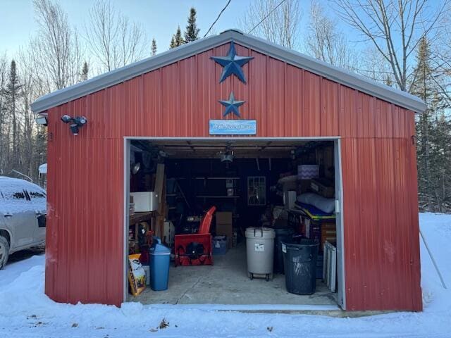 view of snow covered garage