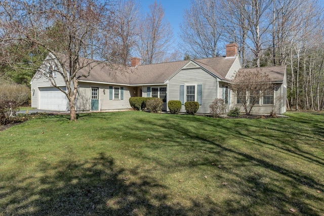 view of front of house with a garage, a chimney, and a front lawn