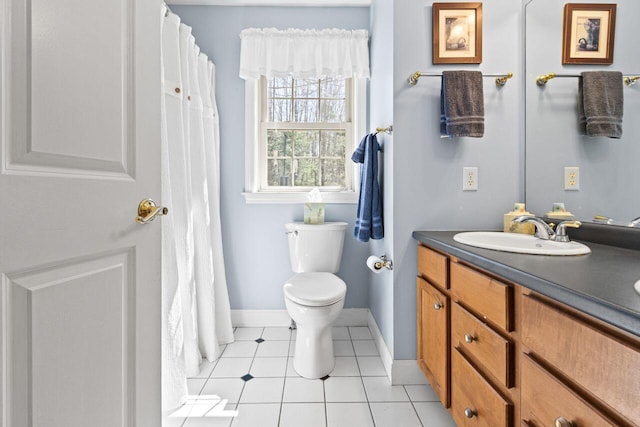 bathroom featuring a shower with curtain, tile patterned flooring, vanity, baseboards, and toilet