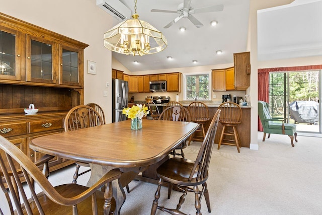dining area featuring visible vents, light colored carpet, vaulted ceiling, ceiling fan with notable chandelier, and recessed lighting