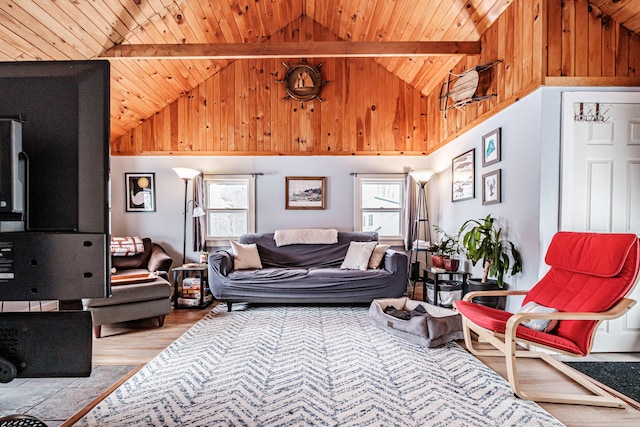 living room with high vaulted ceiling, beamed ceiling, light hardwood / wood-style floors, and wooden ceiling