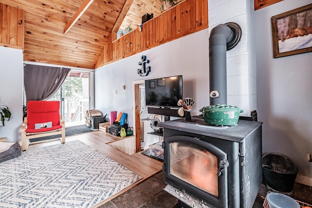 living room with hardwood / wood-style floors, wood ceiling, vaulted ceiling, and a wood stove