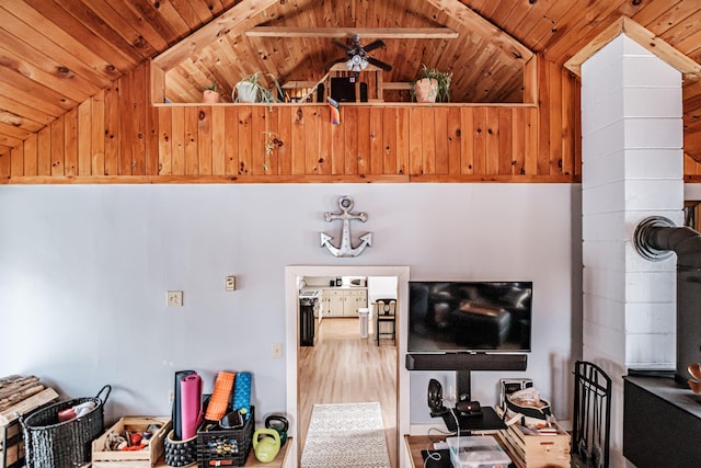 living room featuring ceiling fan, lofted ceiling, and wood ceiling