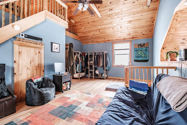 interior space with hardwood / wood-style floors, wooden ceiling, and high vaulted ceiling