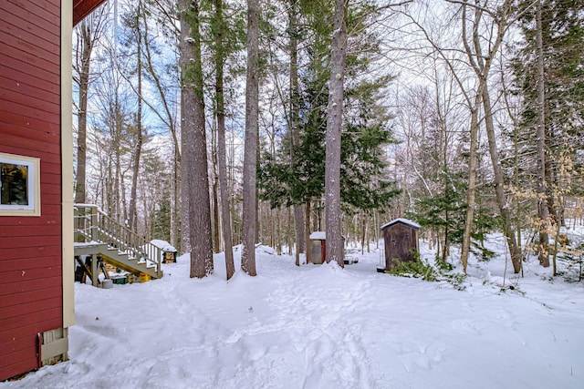 view of yard layered in snow