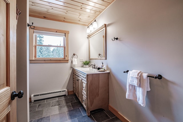 bathroom featuring vanity, a baseboard heating unit, and wooden ceiling