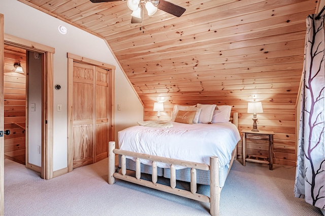 carpeted bedroom featuring wood ceiling, ceiling fan, lofted ceiling, and wooden walls