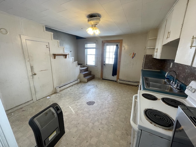 kitchen featuring light floors, a sink, electric range, and baseboard heating