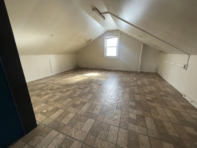 bonus room featuring vaulted ceiling