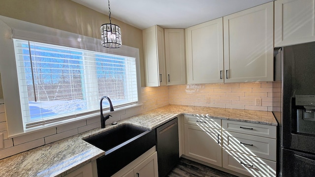 kitchen featuring dishwasher, black refrigerator with ice dispenser, and white cabinets