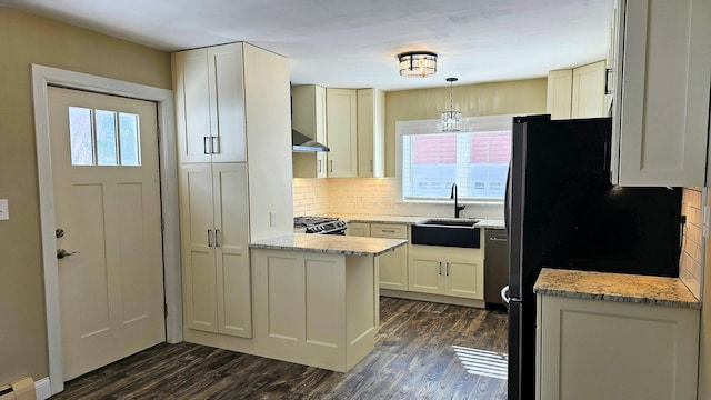 kitchen featuring dark wood-style floors, freestanding refrigerator, pendant lighting, and a baseboard radiator