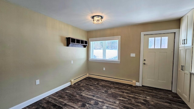 foyer entrance with dark wood-style floors, baseboards, and a baseboard heating unit