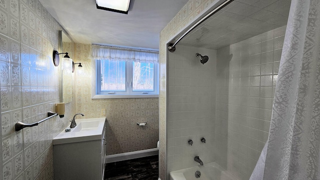 bathroom with baseboards, shower / tub combo with curtain, vanity, and toilet