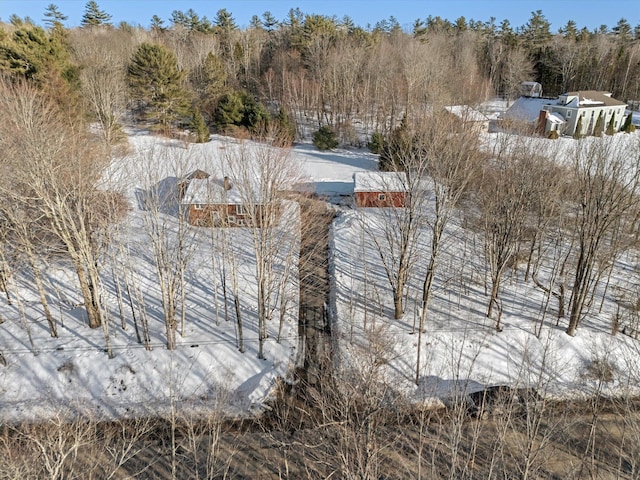 exterior space with a wooded view