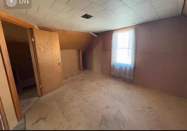 bonus room featuring vaulted ceiling