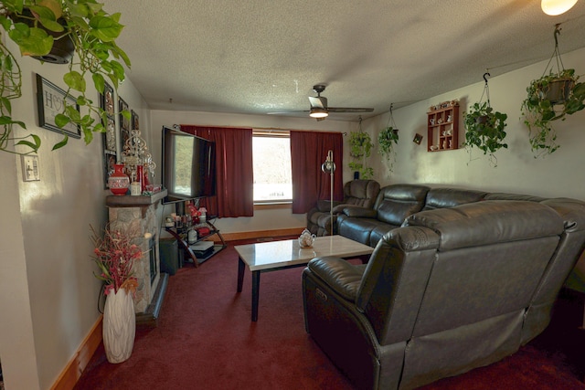 carpeted living area with a ceiling fan, a textured ceiling, and baseboards