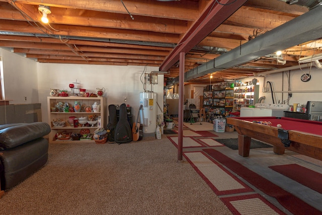 unfinished basement with water heater, carpet floors, pool table, and independent washer and dryer